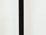 black and gold pedestal with a gold plate on top