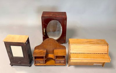 three small wooden boxes and a clock on a table