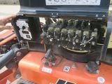 a close up of a machine that is on the ground