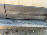 a close up of a car ' s bumper with the door handle missing