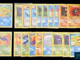 several pokemon cards are lined up in a row on a table