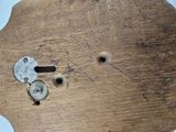 a piece of wood that has some screws on it