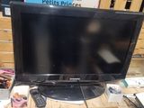 a television that is sitting on a desk in a room