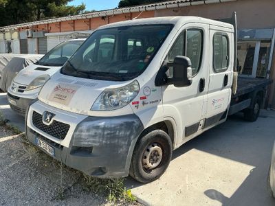a picture of a white van parked in front of a building