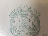 a close up of a plate with a stamp on it