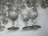 a lot of wine glasses sitting on a table