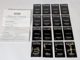 a lot of black and white business cards on a table