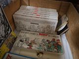 a lot of books in a box on a table