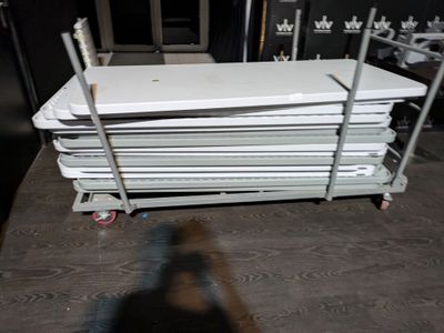 a white bath tub sitting on top of a cart