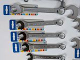 a lot of wrenches that are on the table