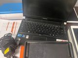 a laptop and a tablet sitting on a desk