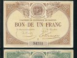 trois billets de banque différents, dont l'un porte l'effigie d'un homme