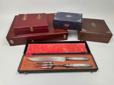 several different types of knives and knives in a box on a table