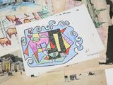 a picture of a collage of drawings on a table