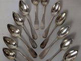 a lot of spoons arranged in the shape of a tree