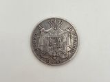 a close up of a silver coin with a coat of arms on it