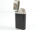 a lighter that is sitting on a white surface