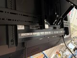 a close up of a flat screen tv mounted on a wall