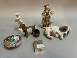 three figurines that are sitting on a table