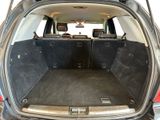 a trunk of a car with the back seats folded down