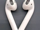 two white airpods sitting next to each other on top of a table
