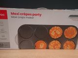 packaging of a muffin pan on a table with a box of muffins in the background