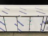 a group of four freezers sitting on top of a counter