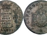a close up of a coin with a picture of a man on it
