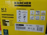 a box of karcher steam cleaners in the store
