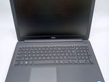 the dell laptop is open and ready to be used