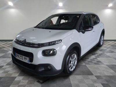 the white citrole is parked on a checkered floor