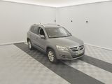 a picture of a car in a garage with a checkered floor