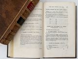 an open book with a bookmark on top of it and a bookmark on the bottom of it