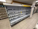 many empty shelves in a store that are empty