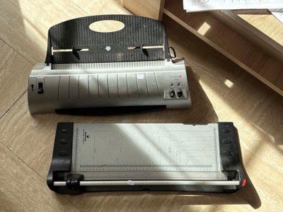 a stapler and a stapler on the floor next to each other