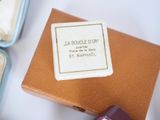 a small box with a ring inside of it on a table