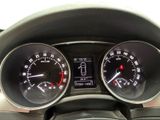a close up of a car dashboard with a speedometer and gauges
