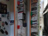 several stacks of dvds are stacked on top of each other on a shelf