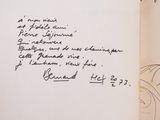 a pile of old books with handwriting on them