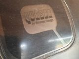 a close up of a metal object with a sticker on it