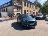 a car parked in front of a building in a parking lot