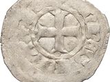 a close up of a coin with a cross on it