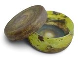 a banana that is sitting in a bowl on a table