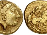 a gold coin with an image of a woman on it