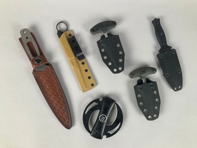 many different types of knives and knives on a white surface