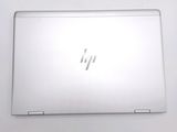 a white laptop that is sitting on a table