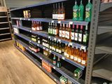 many bottles of wine on the shelves in the store