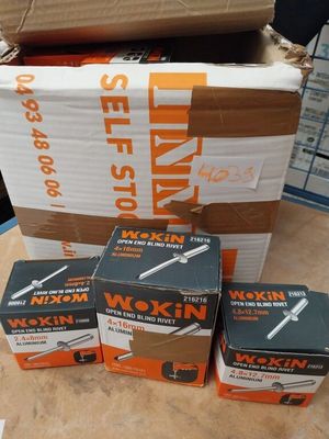 several boxes of tools are stacked on top of each other on a table