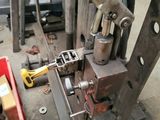 a machine that is sitting on the ground next to some tools