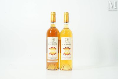 two bottles of wine sitting next to each other on a table